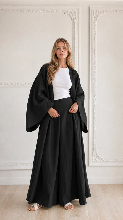 Full-length view of woman wearing classic black 2-piece kimono cardigan and wide leg set