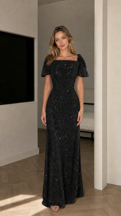 Front view of model wearing Black shimmering sequin maxi evening gown