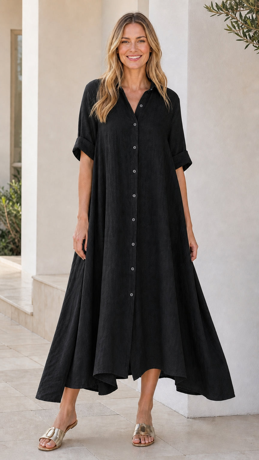 Front view of woman wearing black button-down midi shirt dress