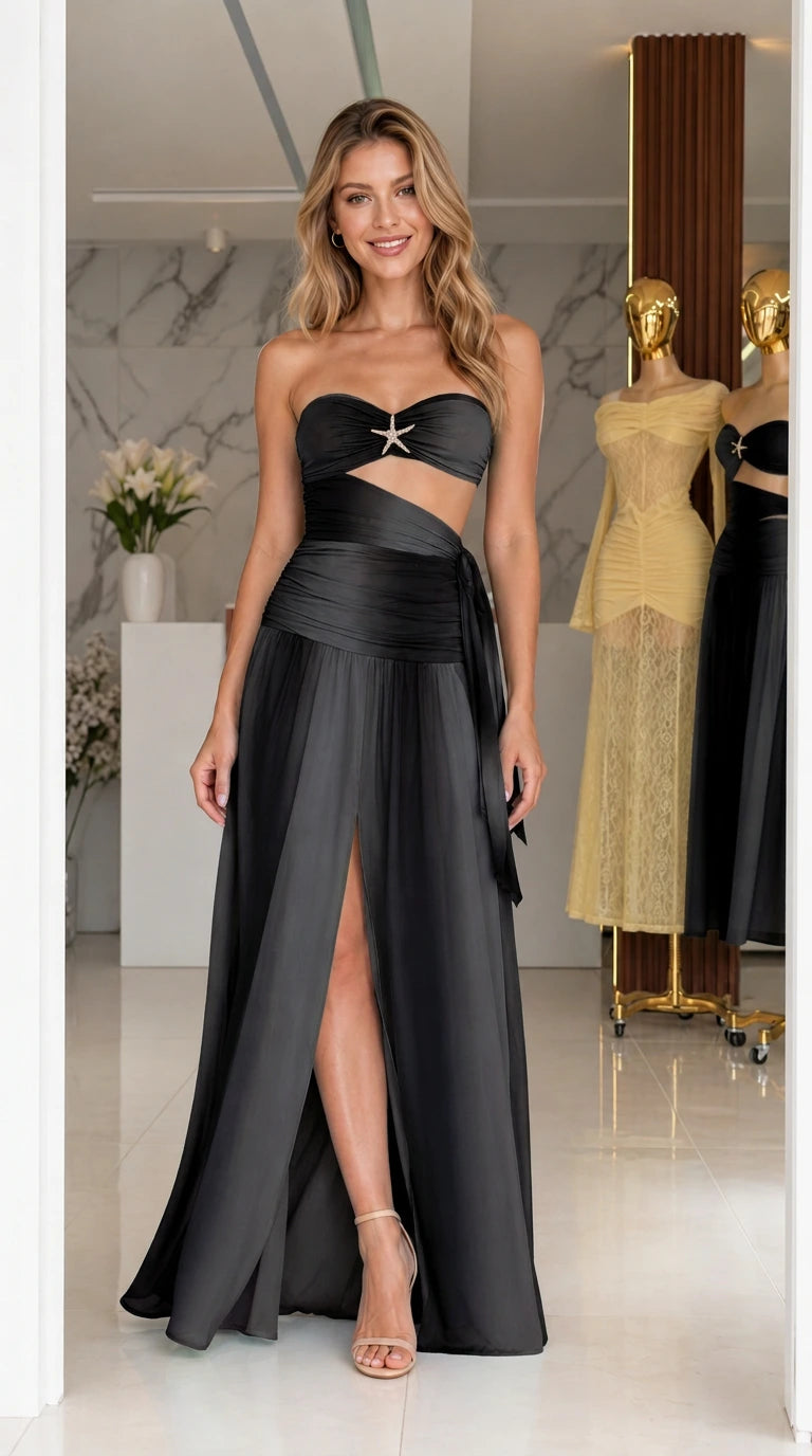 Model wearing black strapless cutout long dress