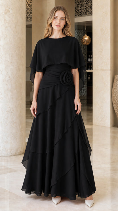 Front view of woman wearing black chiffon cape formal evening dress