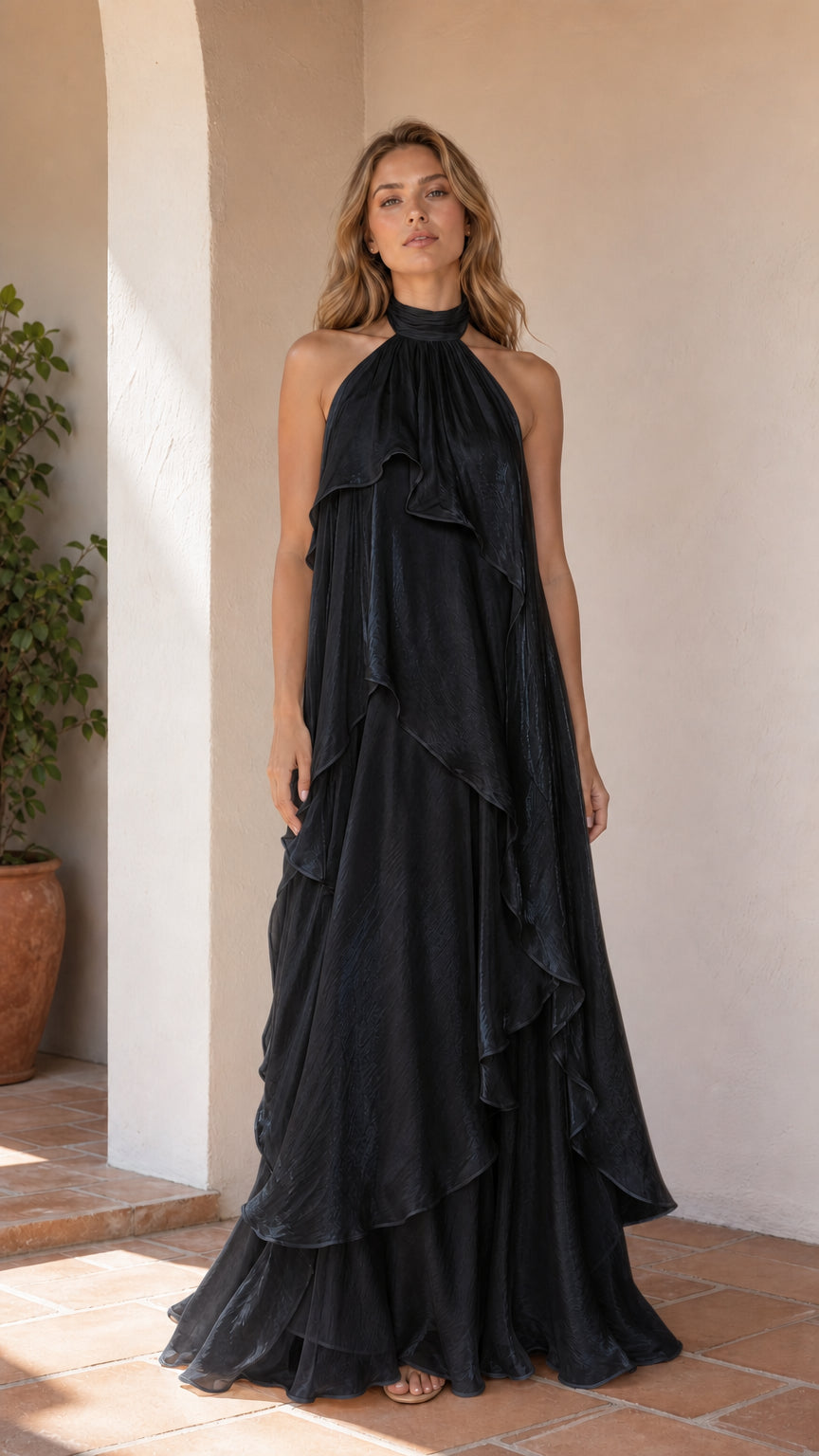 Full length view of model wearing black ruffle halter maxi dress