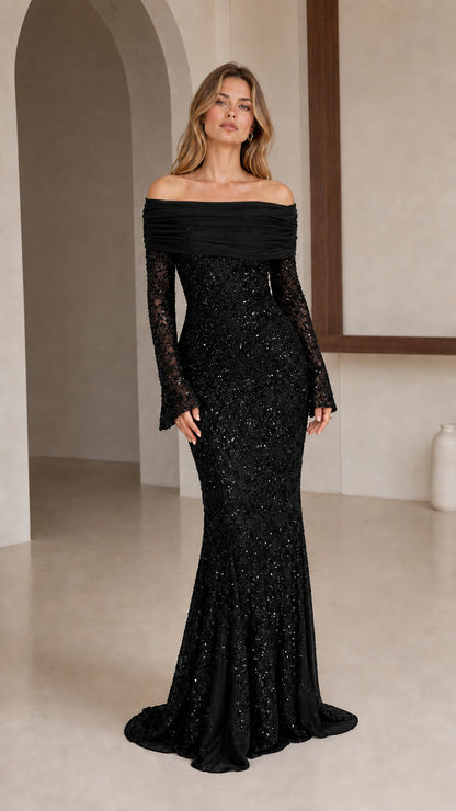 Model wearing black off-shoulder sequin evening gown