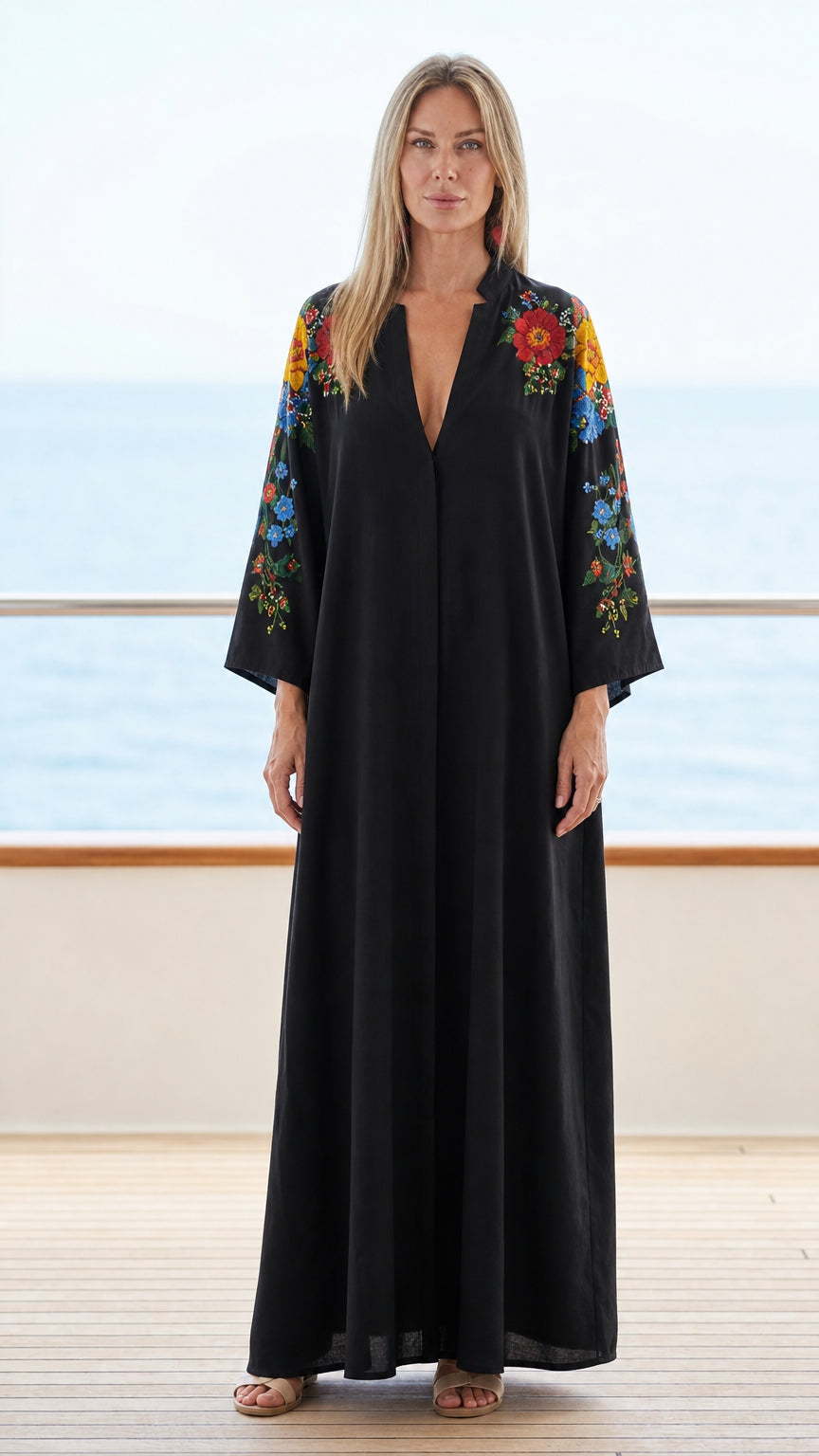 Model wearing black floral embroidered maxi kaftan dress