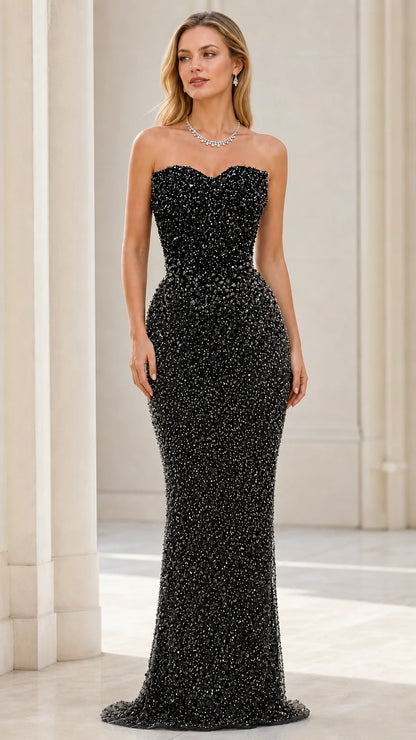 Front view of model wearing black beaded strapless mermaid evening gown