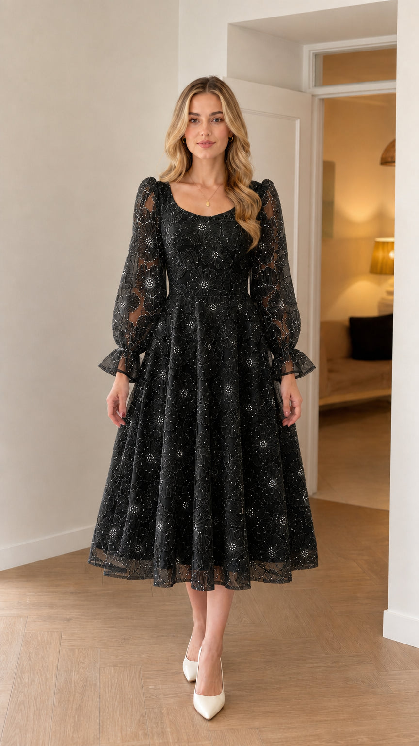 Model wearing classic black floral embroidered midi dress with sheer sleeves