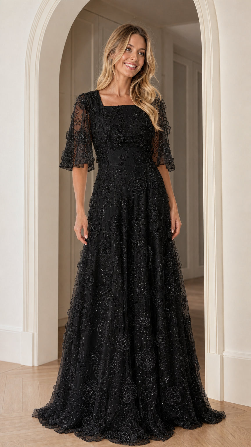 Front view of black floral applique maxi dress