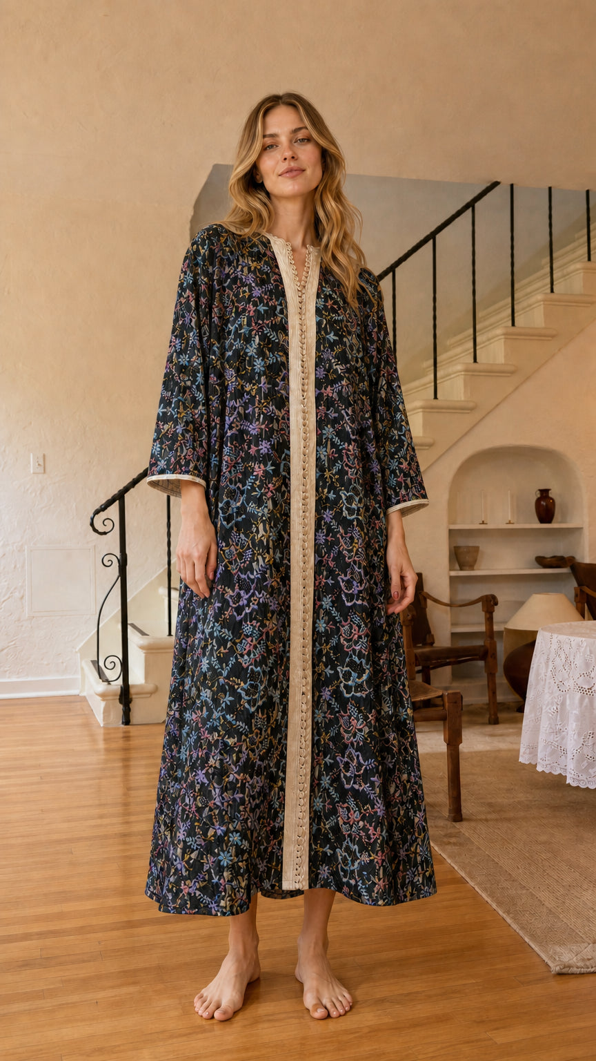 Front view of black floral embroidered kaftan dress