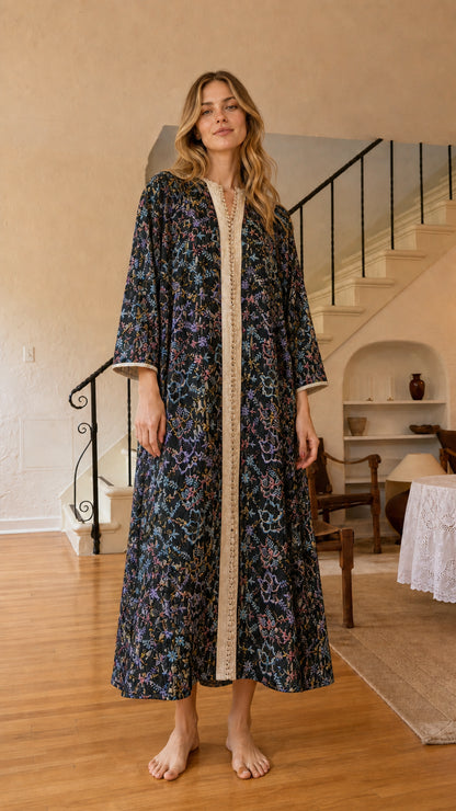 Front view of black floral embroidered kaftan dress