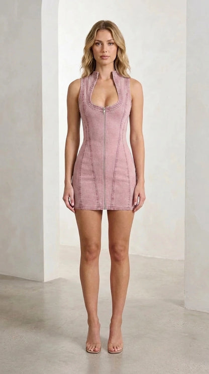 Front view of pink denim mini dress on model