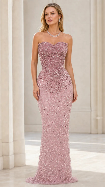 Front view of model wearing pink beaded strapless mermaid evening gown