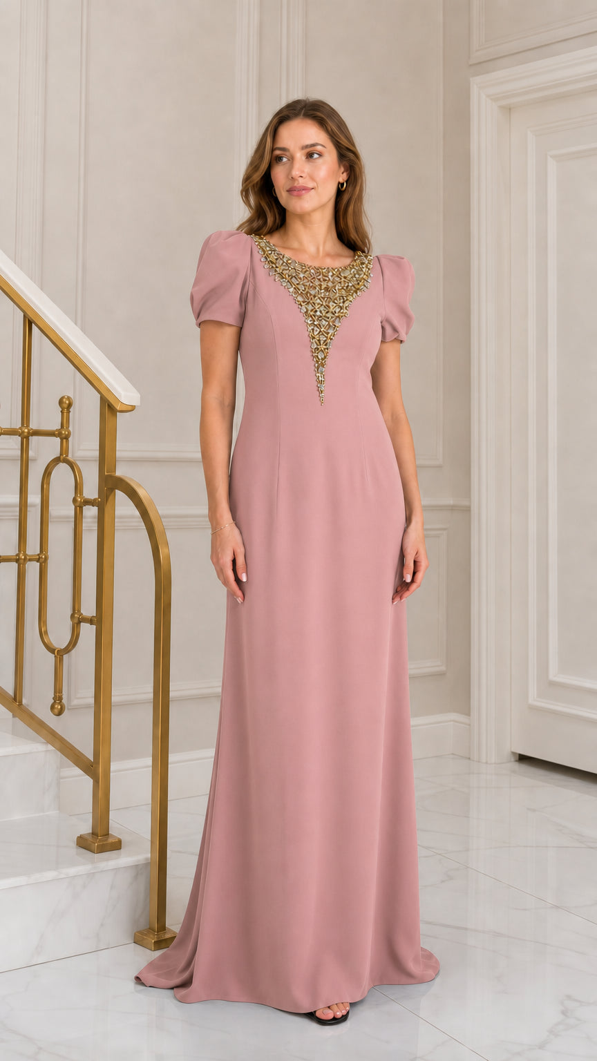 Front view of woman wearing dusty pink rhinestone embellished puff sleeve maxi evening gown