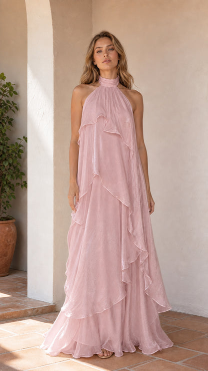 Full length view of model wearing pink ruffle halter maxi dress