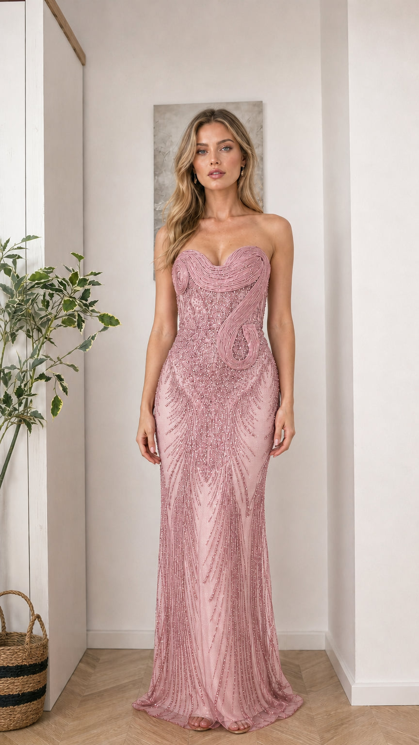 Woman wearing pink strapless beaded evening gown