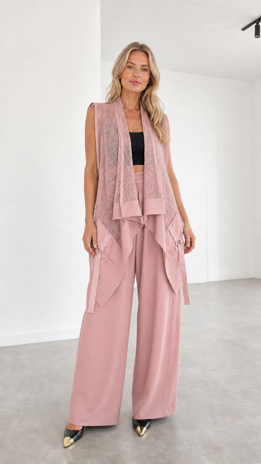 Model wearing dusty pink two-piece set