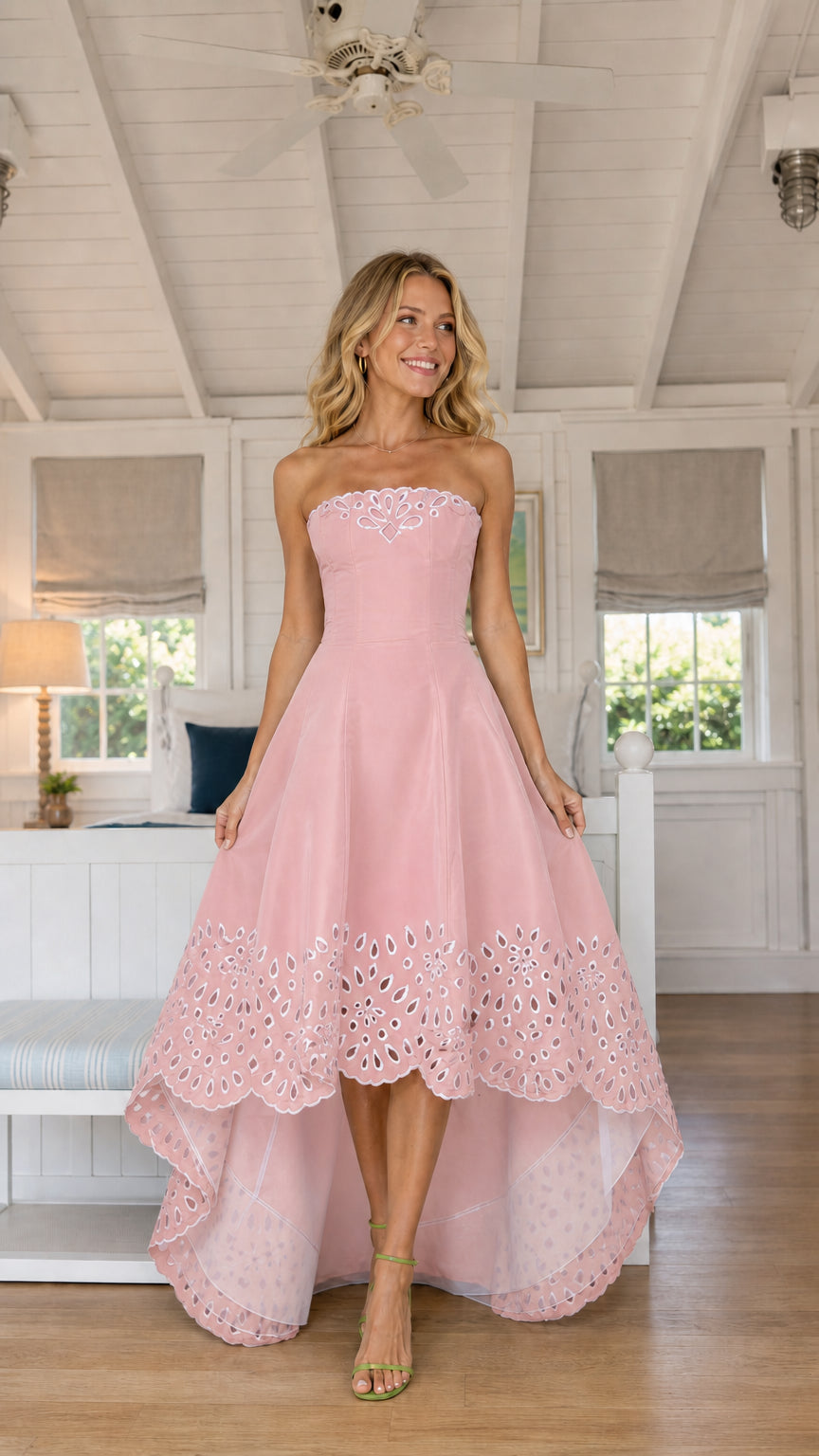 Model wearing pink strapless high-low party dress