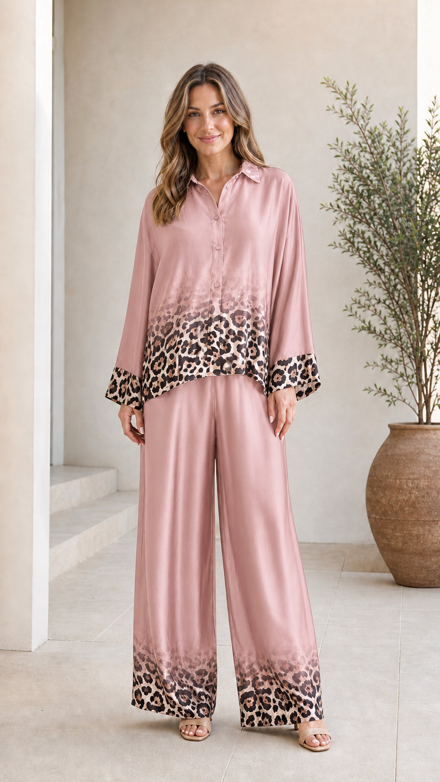 Woman wearing pink satin leopard ombre pant set