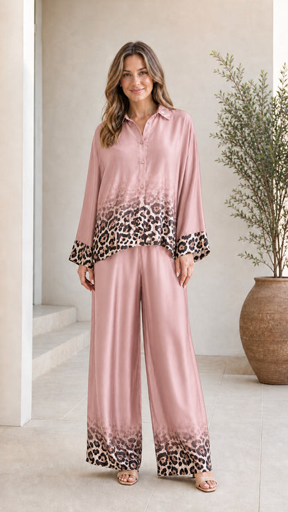 Woman wearing pink satin leopard ombre pant set