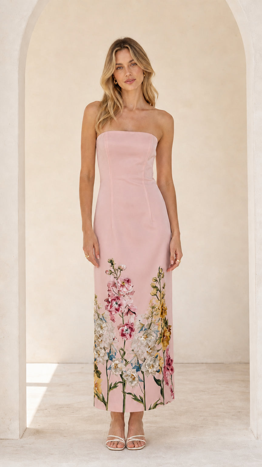 Model wearing pink floral strapless midi maxi dress