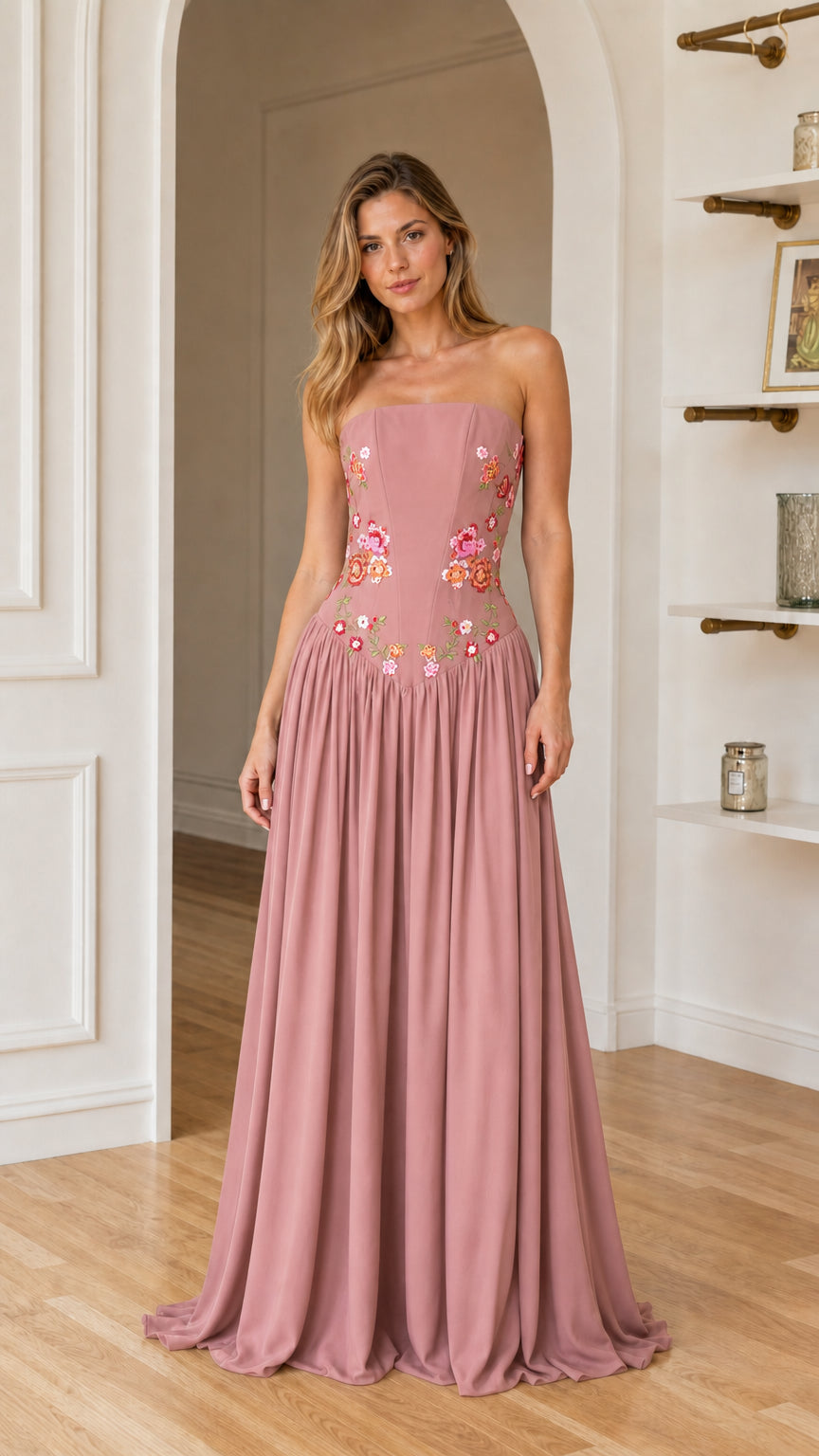 Front view of woman wearing dusty rose floral embroidered maxi dress