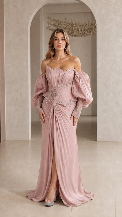 Model wearing Dusty Pink pleated formal maxi dress with high leg slit and puff sleeves