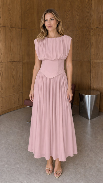 Full-length front view of dusty pink sleeveless basque waist pleated midi dress