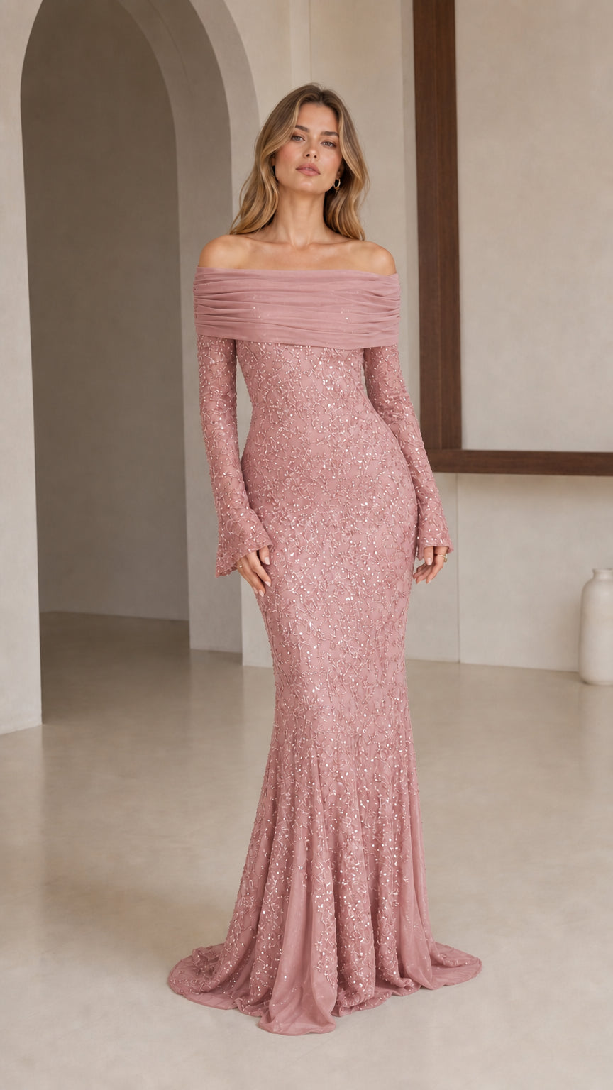 Model wearing rose pink off-shoulder sequin evening gown