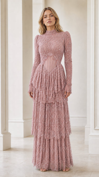 Model wearing dusty pink embellished corset tiered maxi dress