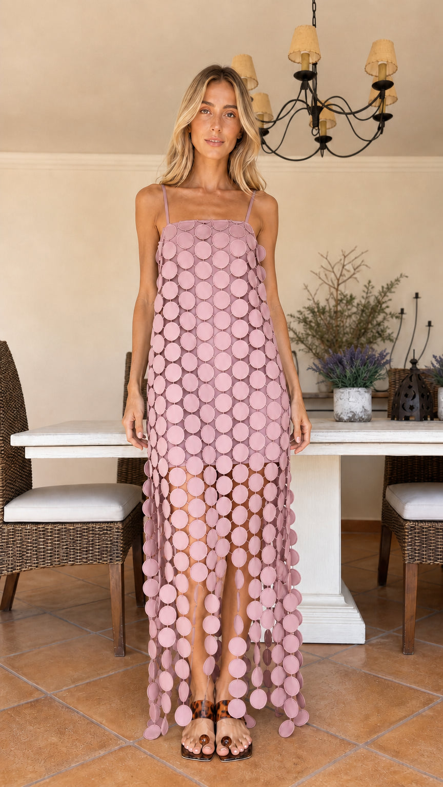 Front view of woman wearing dusty pink circle cutout maxi dress