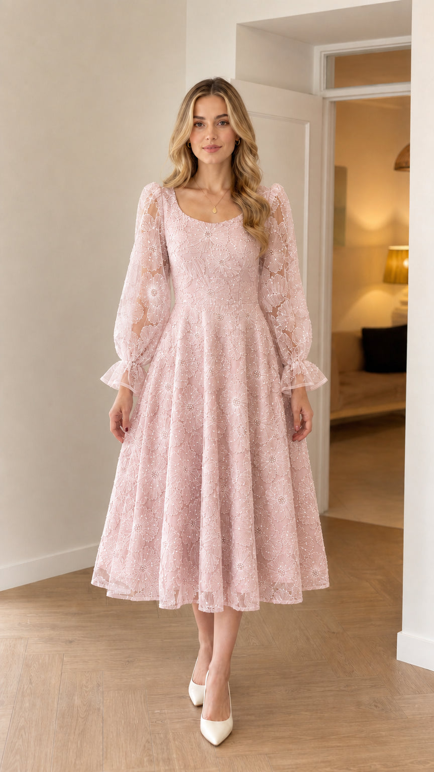 Model wearing blush pink embroidered A-line midi cocktail dress