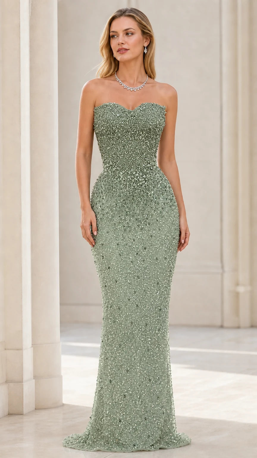 Front view of model wearing sage green beaded strapless mermaid evening gown