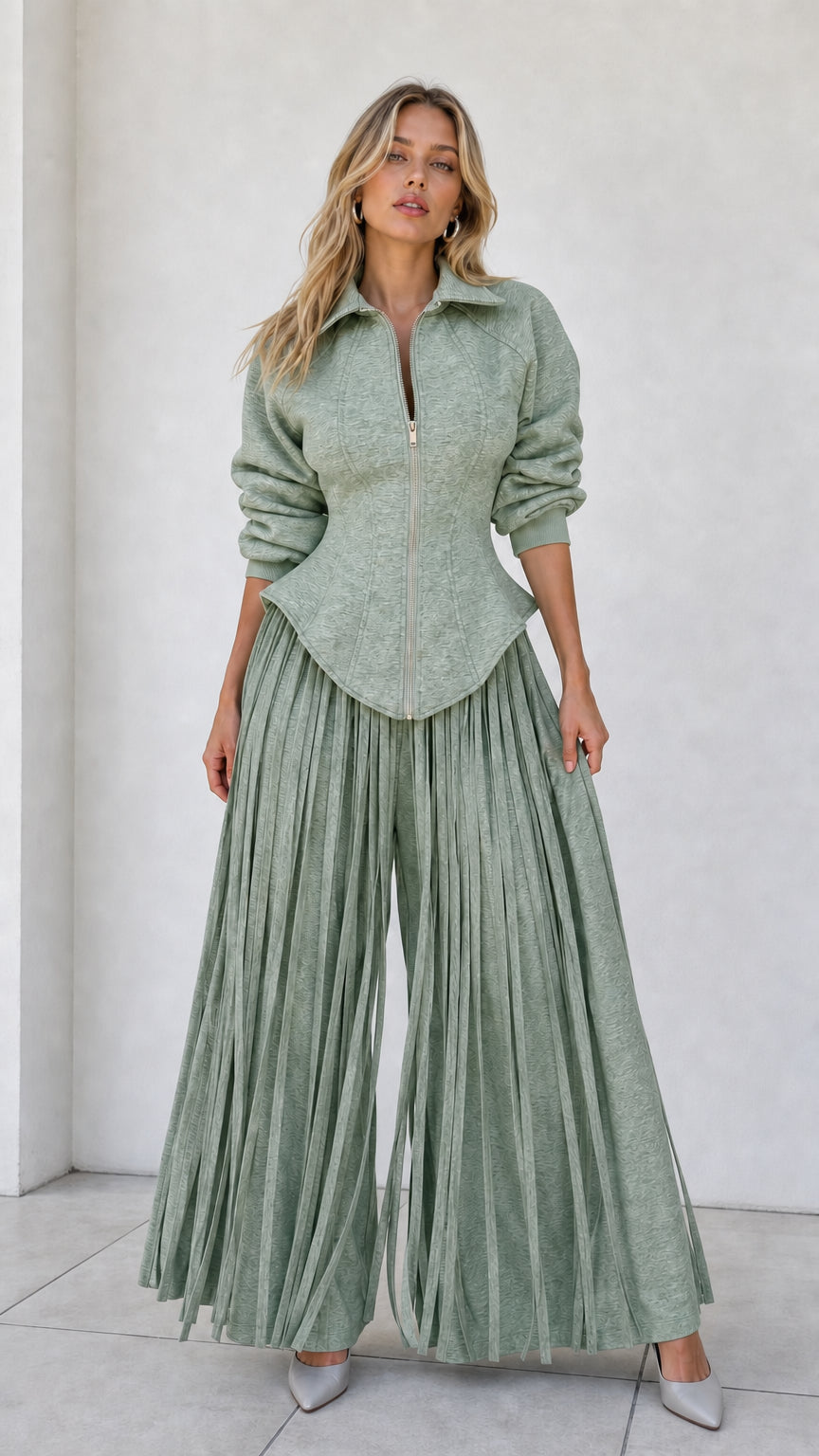 Model wearing sage green matching two-piece structured top and wide-leg pant set