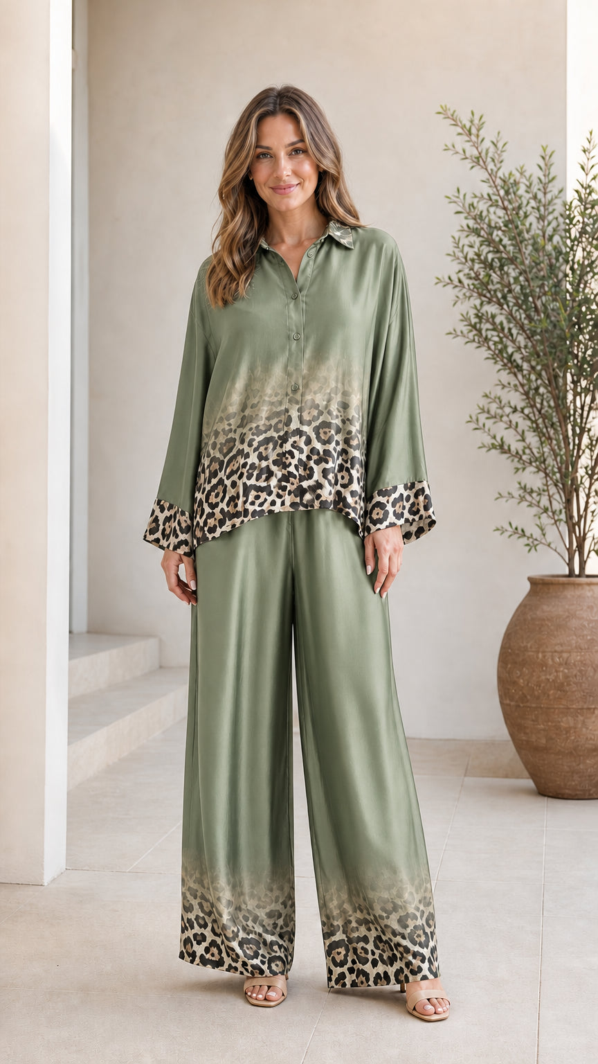 Woman wearing olive green satin leopard ombre pant set