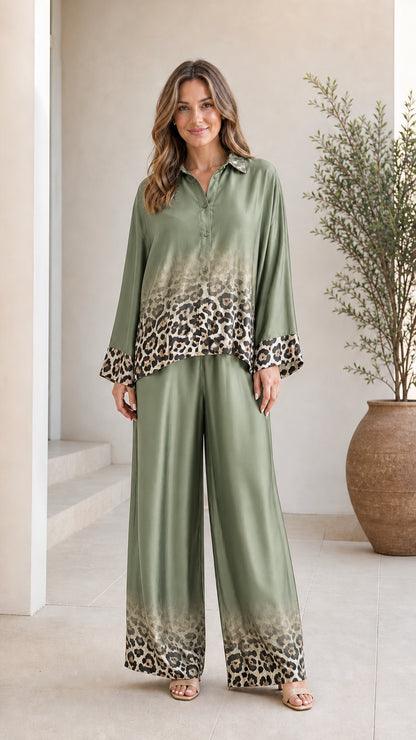 Woman wearing olive green satin leopard ombre pant set