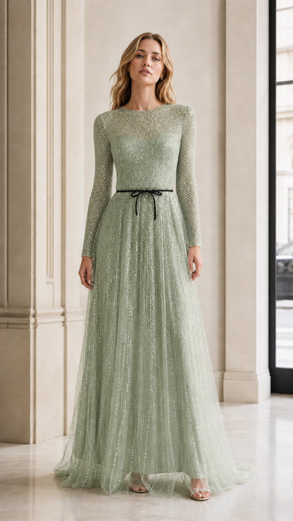 Front view of model in sage green sequin evening gown