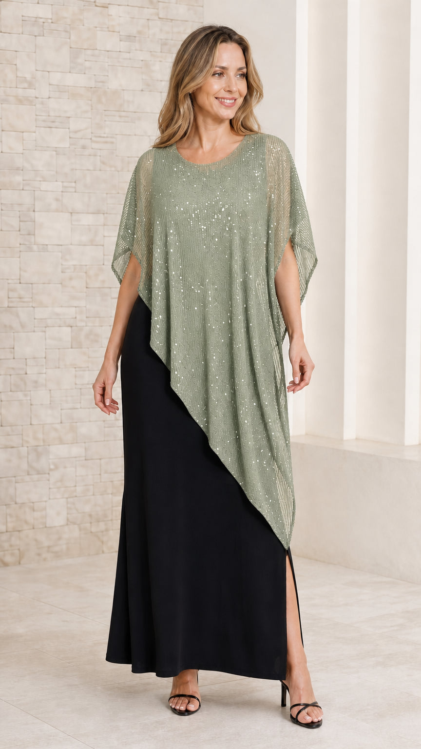 Front view of model in black maxi dress paired with a sage green sequined capelet overlay