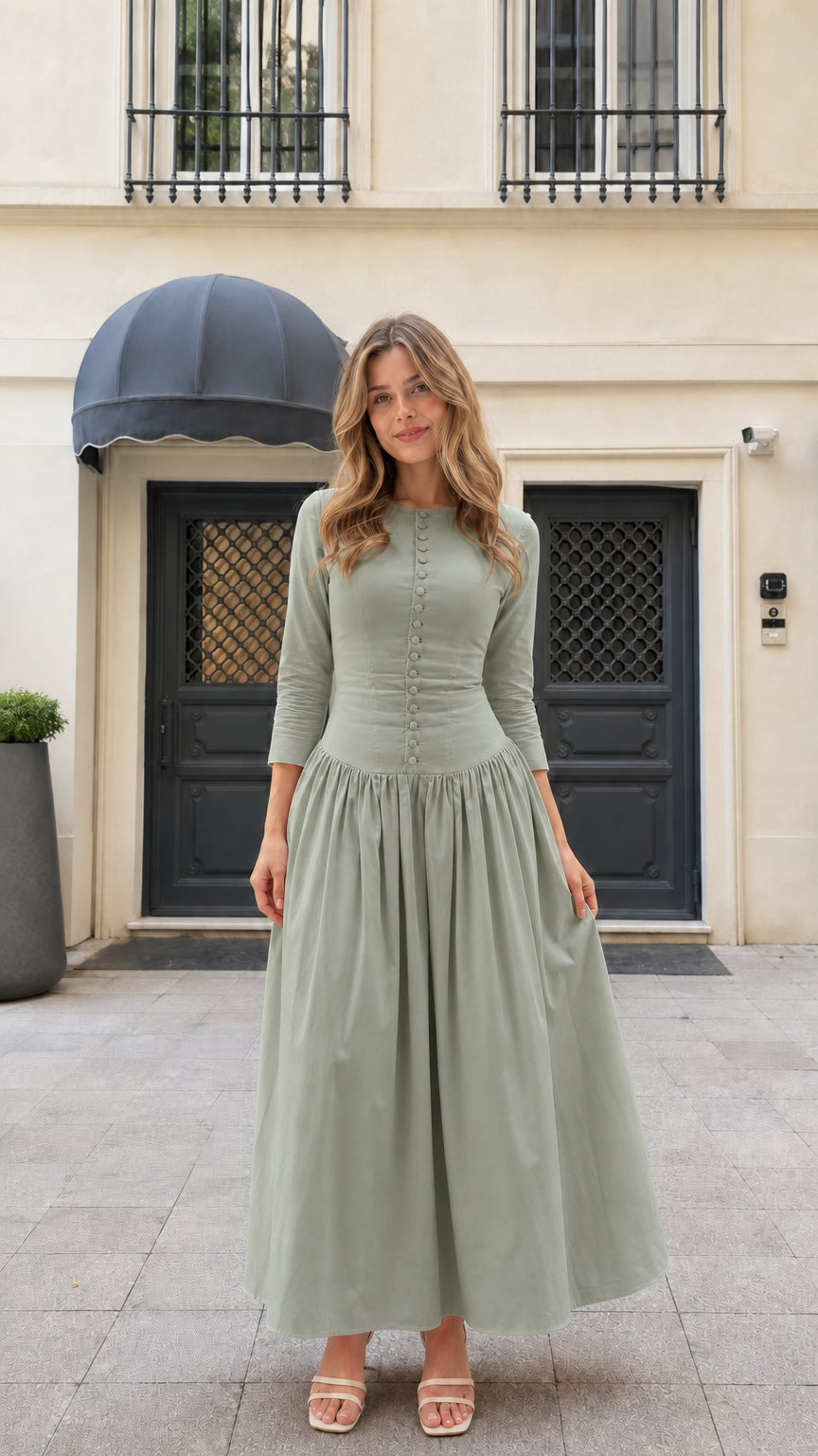 Model wearing sage green 3/4 sleeve pleated button-front maxi dress