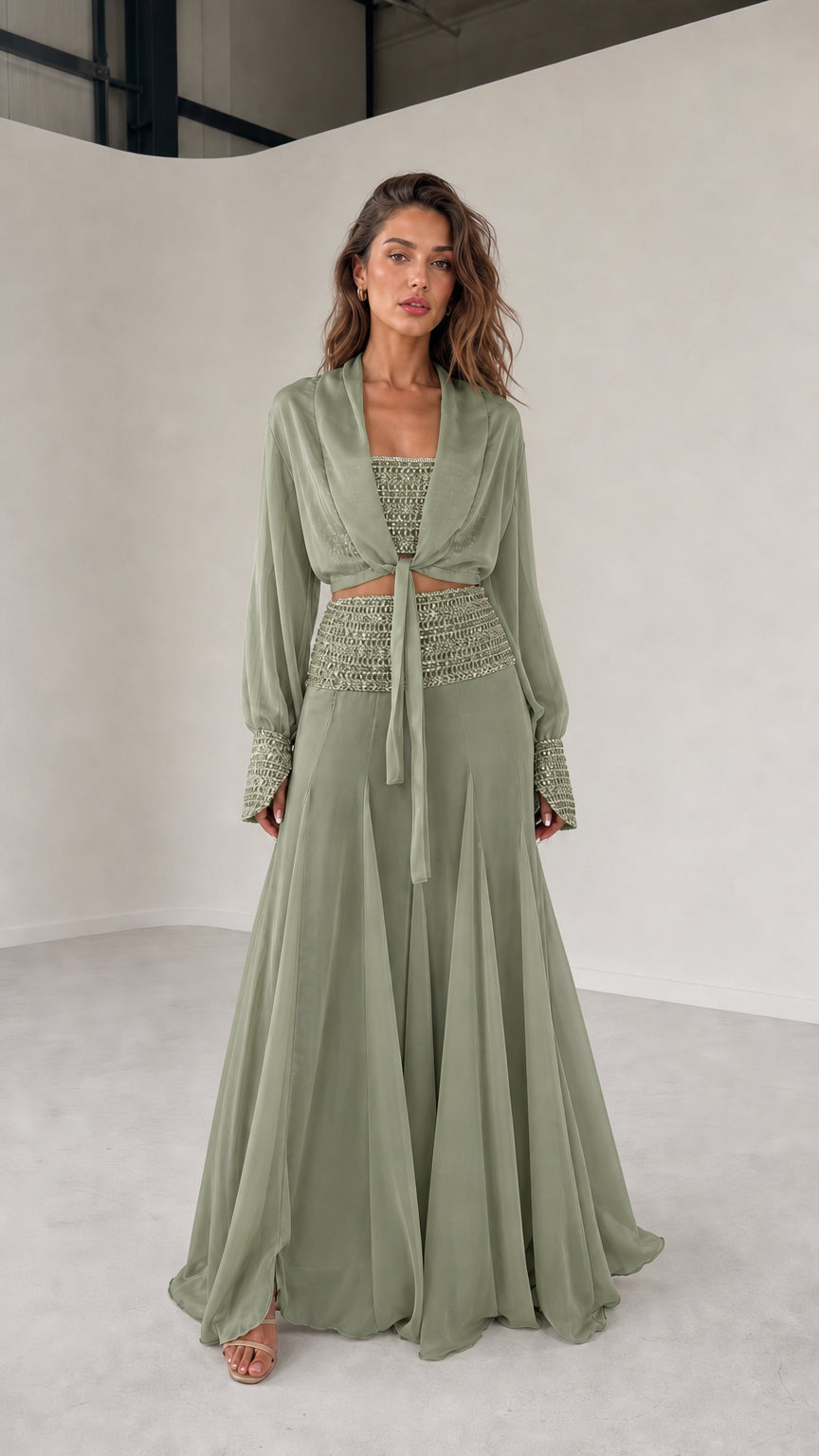 Model wearing sage green three-piece chiffon set