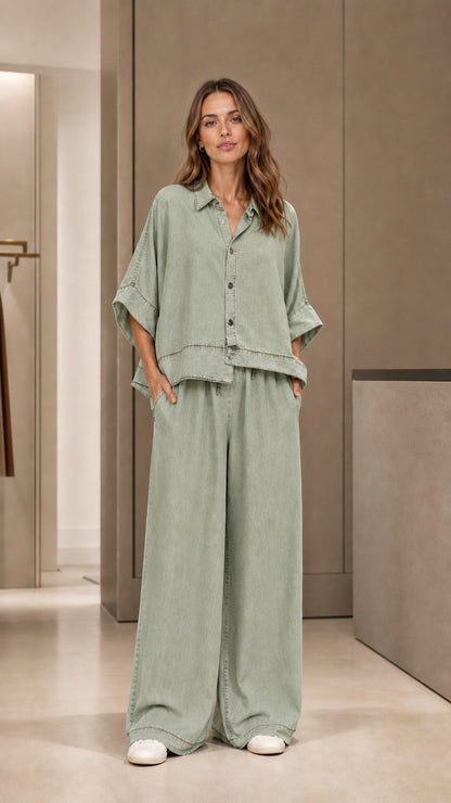 Full front view of model wearing sage green two-piece pants set