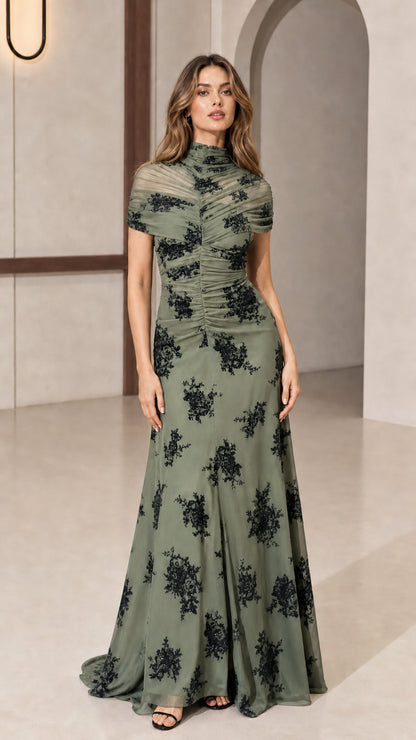 Model wearing sage green evening gown