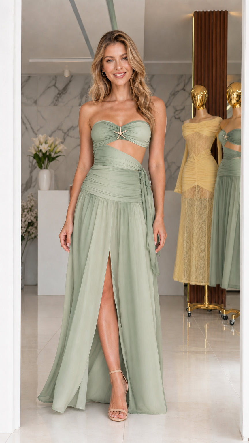 Model wearing sage green strapless cutout long dress