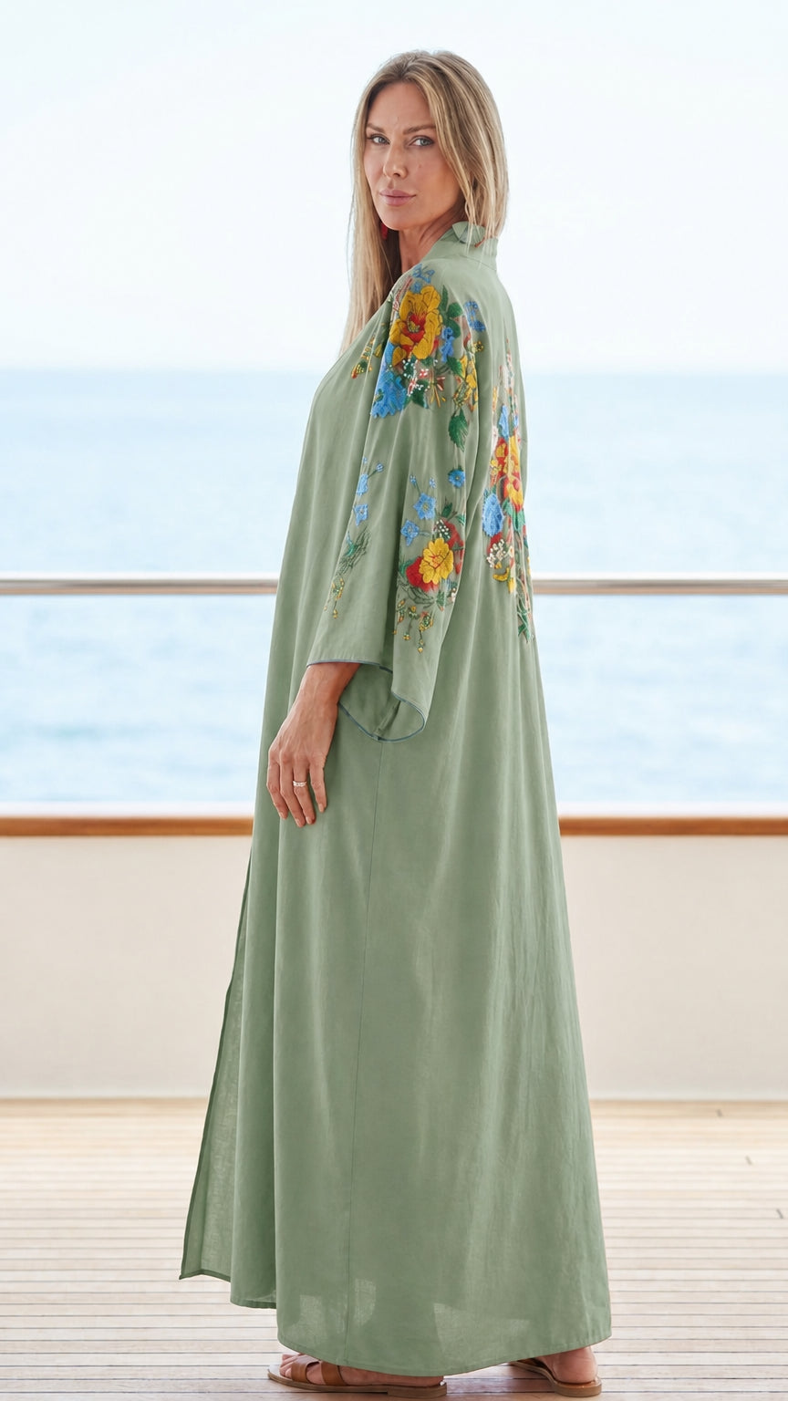 Model wearing sage green floral embroidered maxi kaftan dress