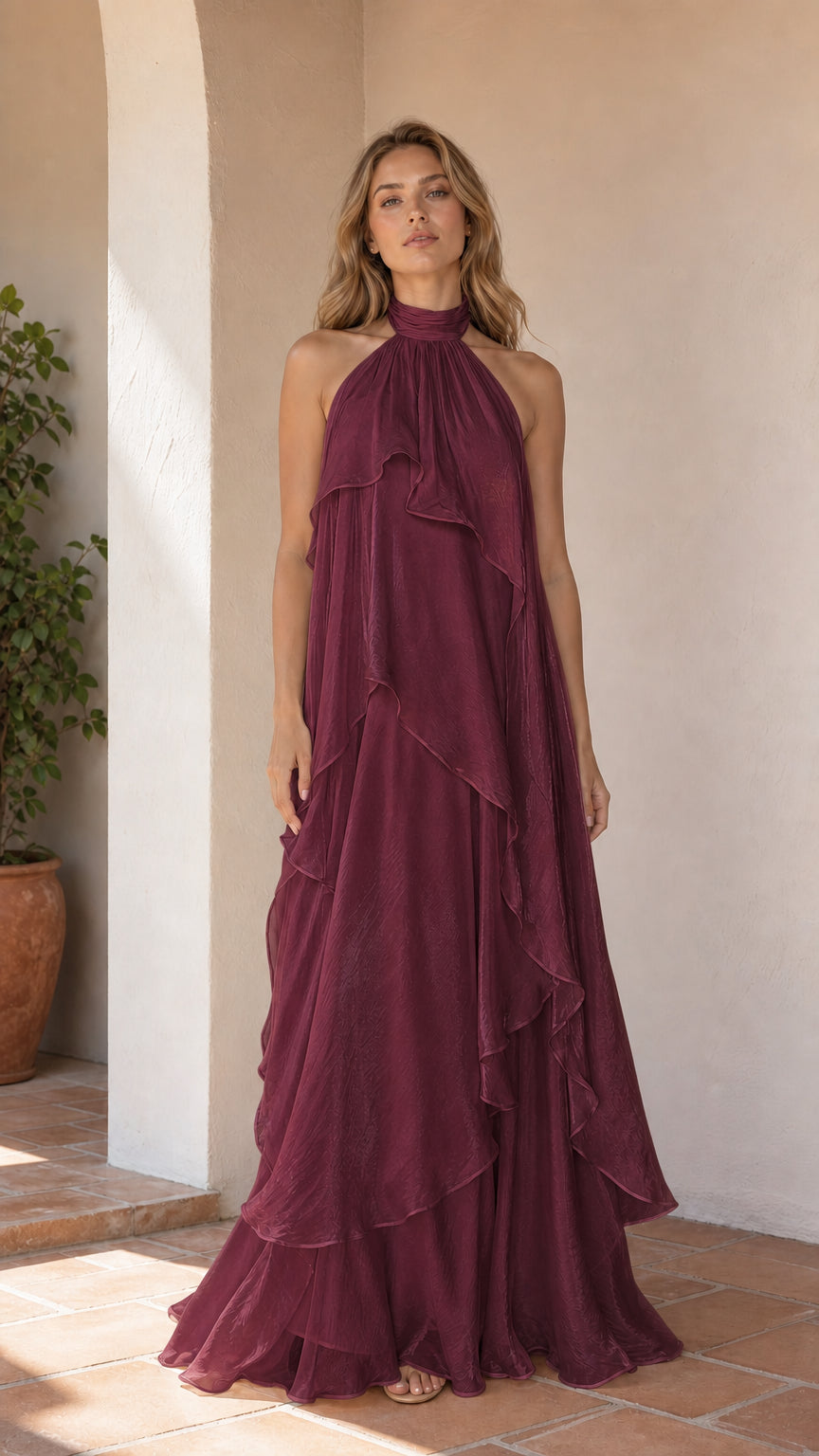 Full length view of model wearing burgundy ruffle halter maxi dress