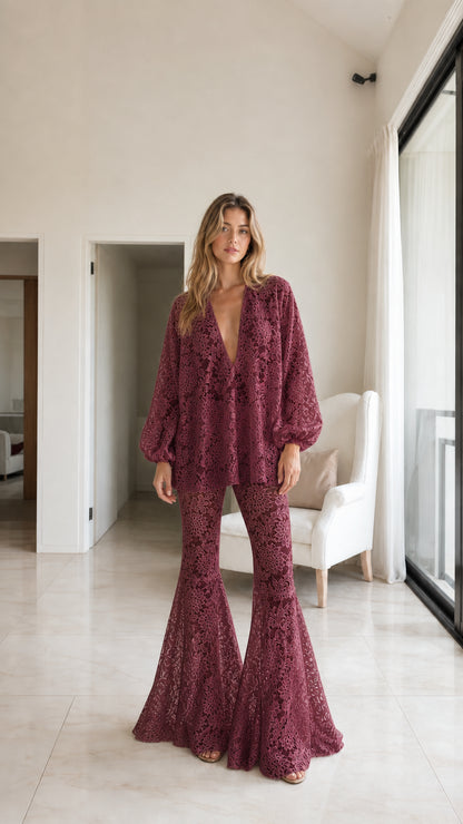 Model wearing burgundy floral lace two-piece set, front view