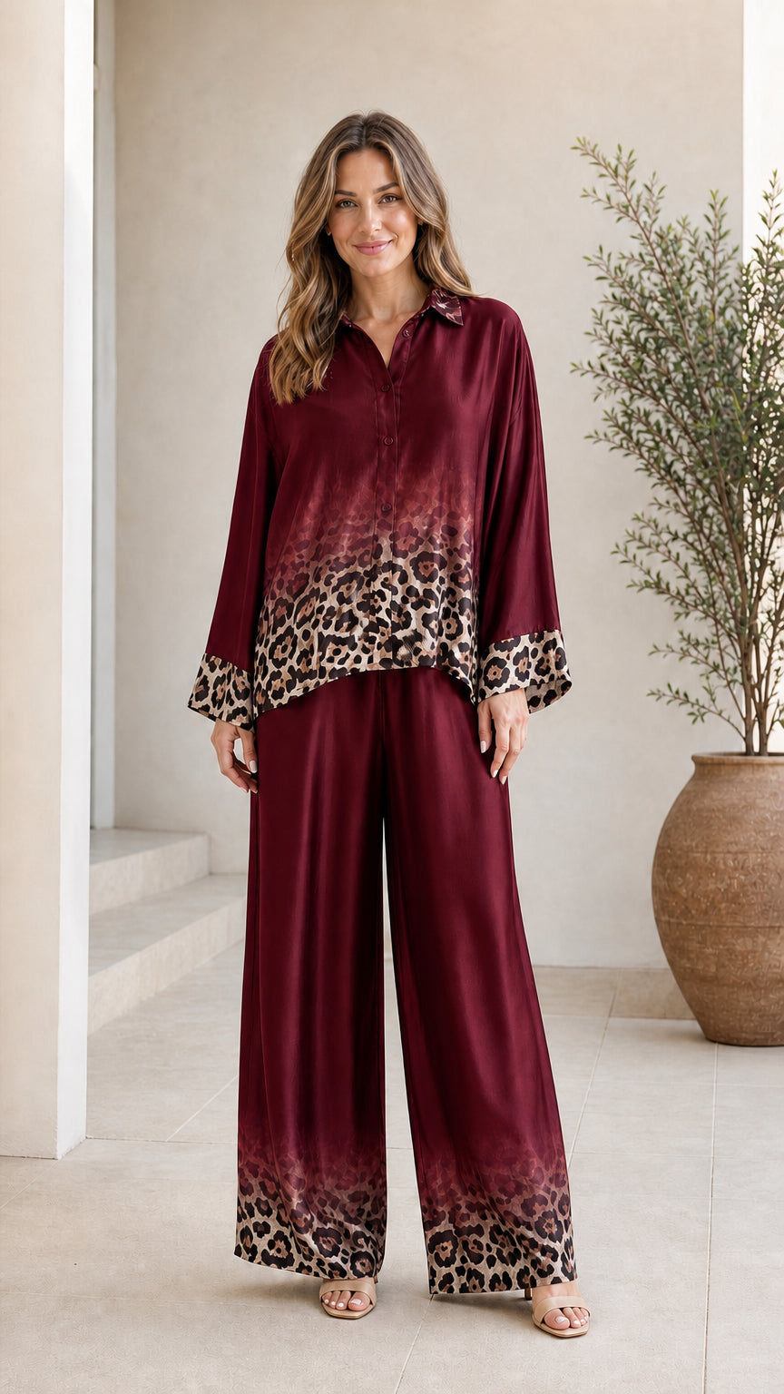 Woman wearing burgundy satin leopard ombre pant set