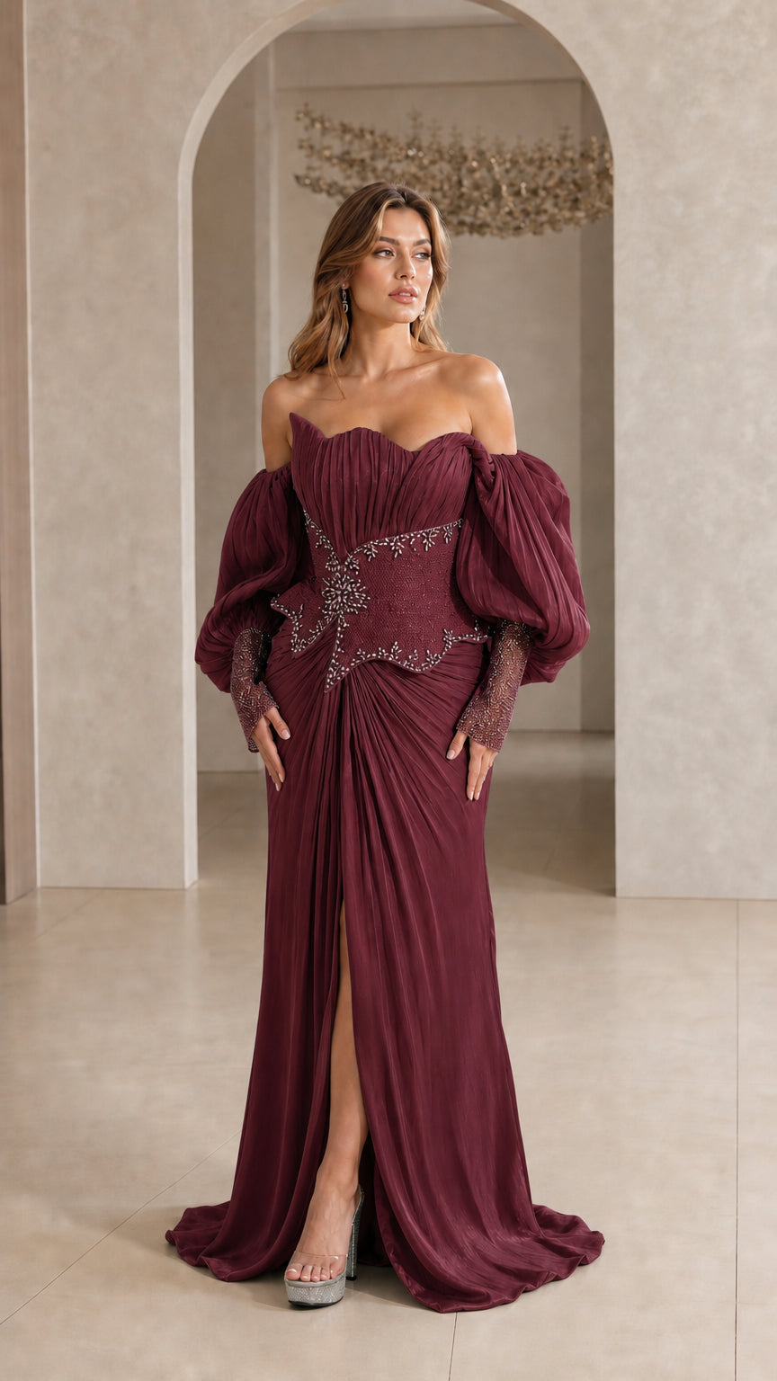 Model wearing Burgundy red off-the-shoulder pleated evening gown with beaded bodice