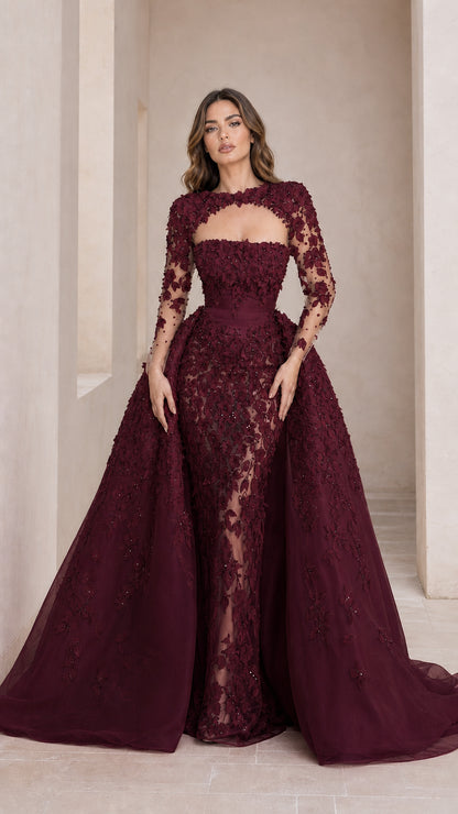 Front view of burgundy luxury evening gown with overskirt