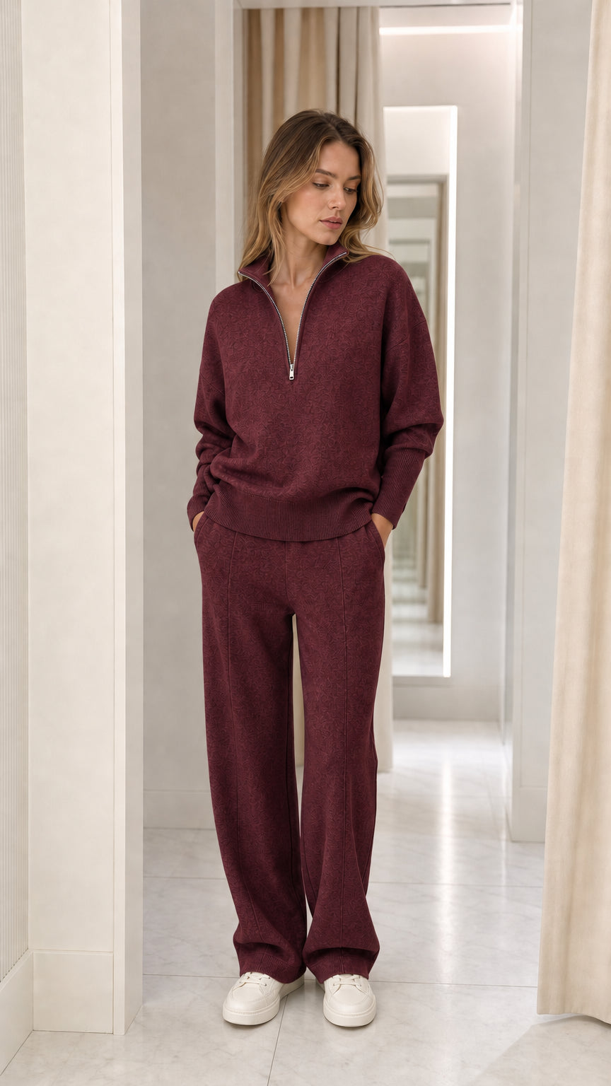Full-length view of woman wearing burgundy two-piece knit lounge set