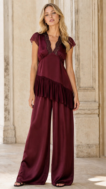Burgundy color variant of the satin ruffle tunic and wide leg pants