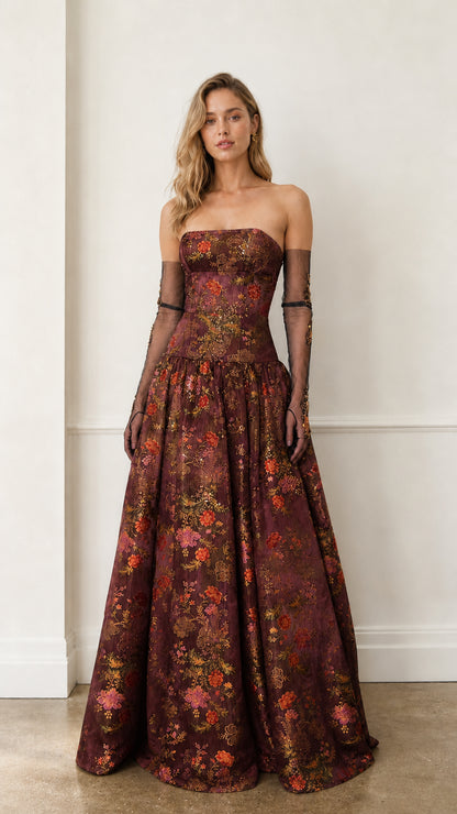Front view of burgundy floral strapless evening gown